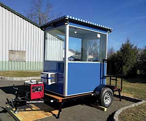 Mobile guard shack mounted on flatbed trailer