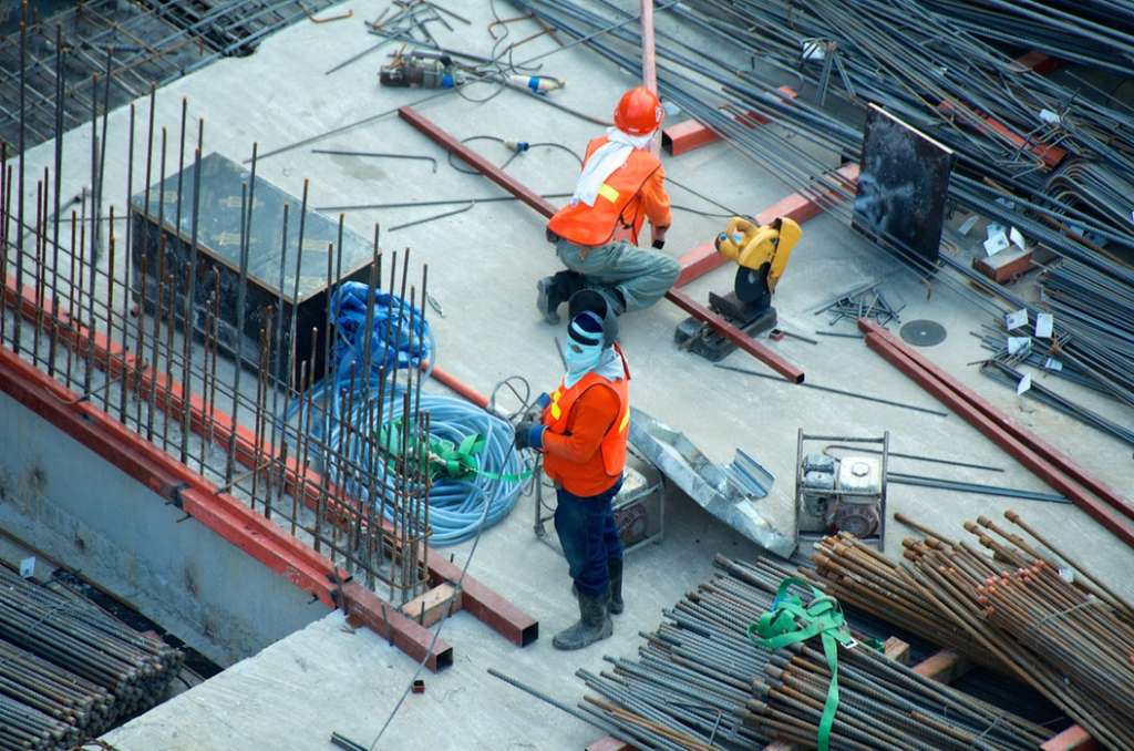 Construction workers and materials on a work site - Guardian Booth