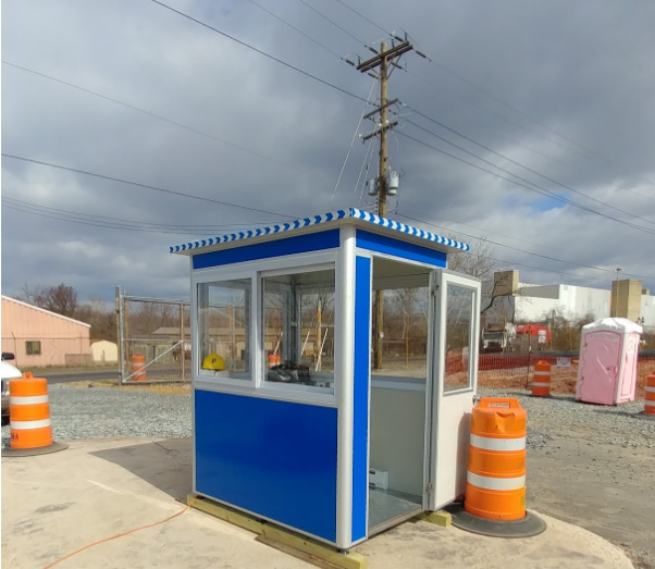 Blue ticket booth outside a parking lot