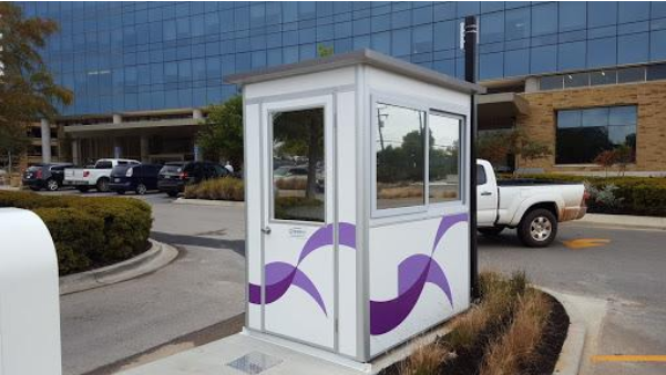Custom designed guard booth outside of a parking lot.