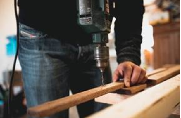 A construction worker working with wood