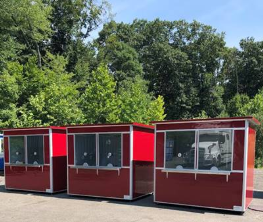 Three bright red ticket booths