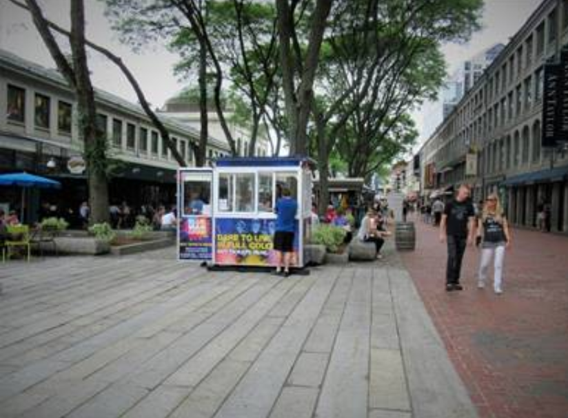 Ticket booth with advertisement on city street