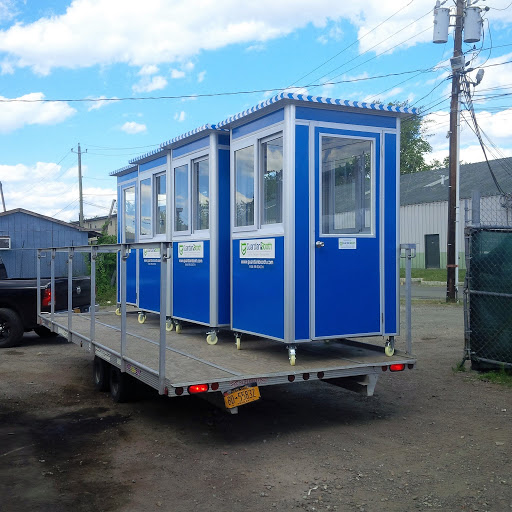 Trailer carrying 4 blue guard booths