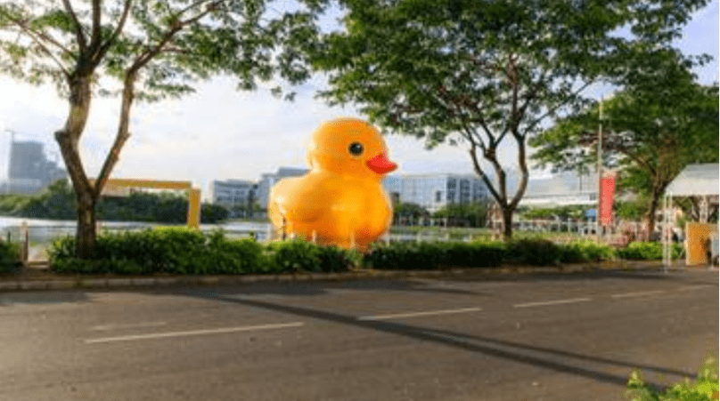 Giant yellow inflatable duck in a park