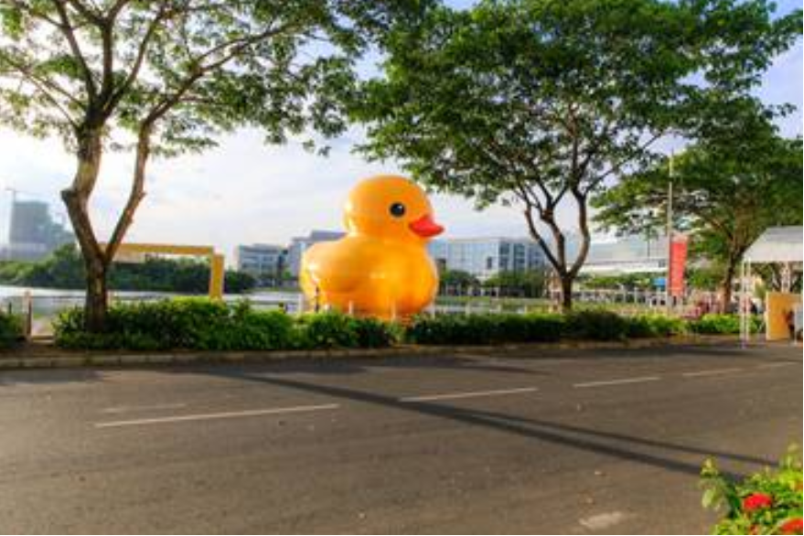 Giant yellow inflatable duck in a park