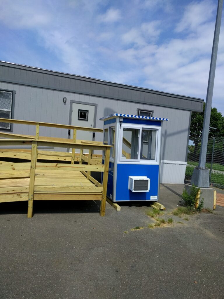 4x4 Security Guard Booth on Construction Site in Queens, NY with Built-in AC, Sliding Windows, and Anchoring Brackets