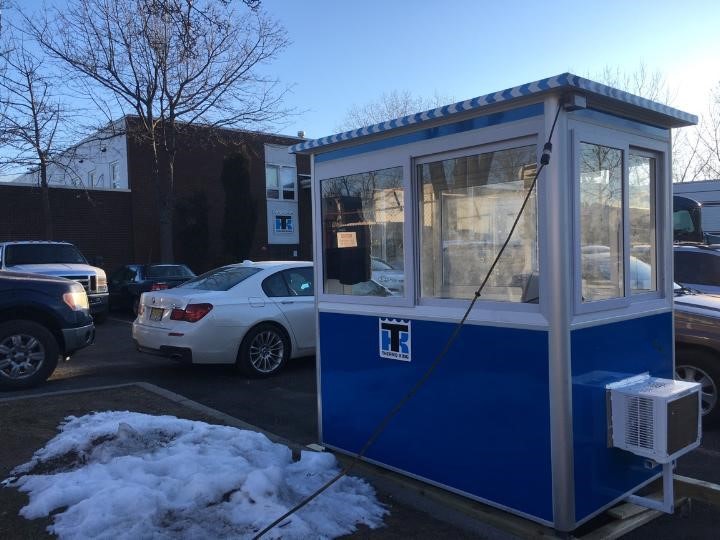 4x6 Parking Booth in Carlstadt, NJ in a parking lot with Sliding Windows, Built-in AC, Baseboard Heaters, and Swing Door