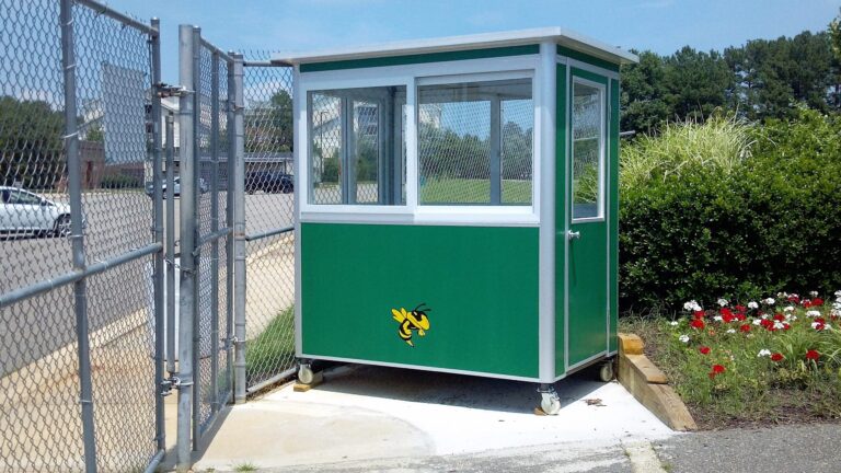 4x6 Ticket Booth in Great Mills, MD outside a School with Caster Wheels, Custom Exterior Color,  and Perimeter Security Fencing