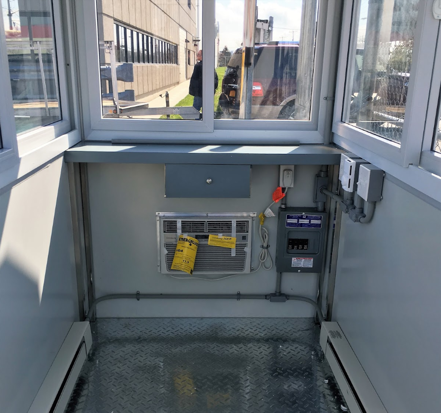 Guardian Booth interior with built-in AC, baseboard heaters and breaker panel box