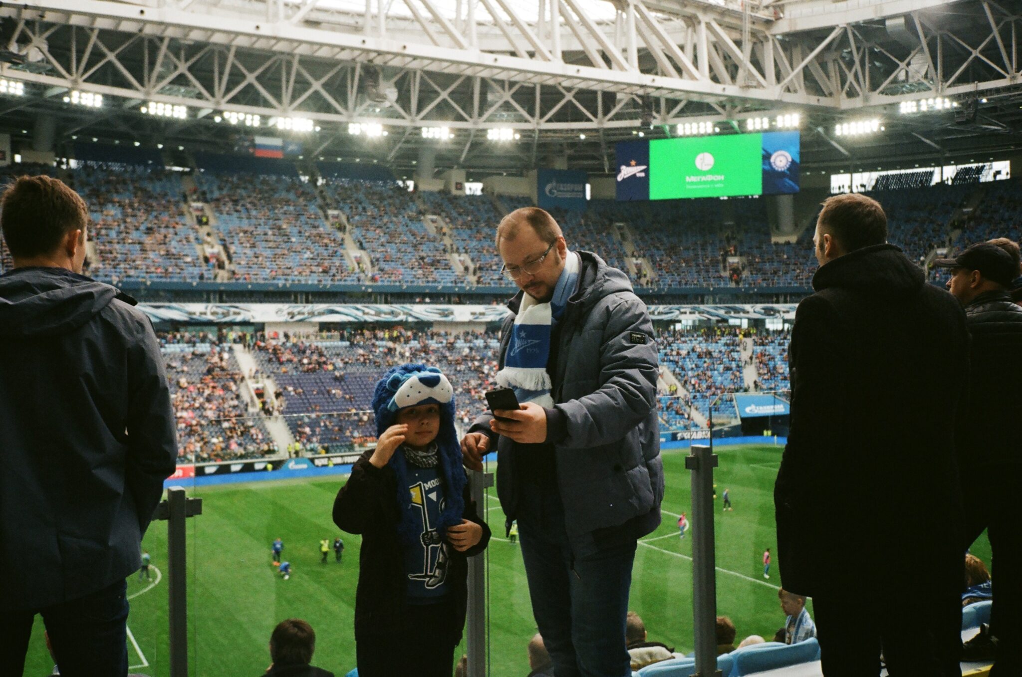 A man and boy inside a stadium