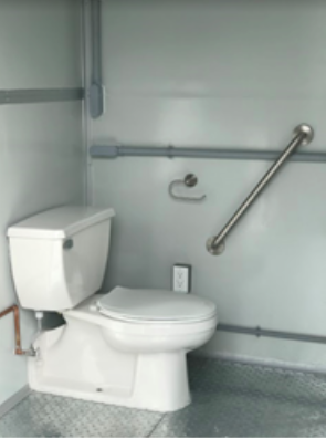 A toilet in a restroom of a modular building