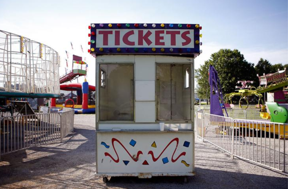A white carnival ticket booth with 
