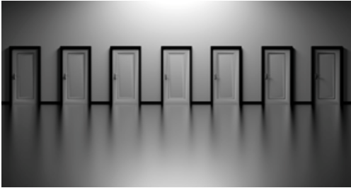 Seven white doors with black outlines lined up in a row