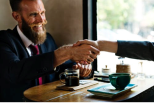 Employer shaking hands with employee