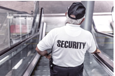 A security guard on an escalator