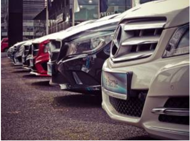 Front end of cars lined up in parking lot