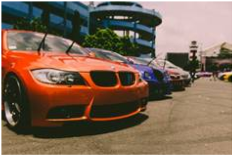 Orange car in a parking lot