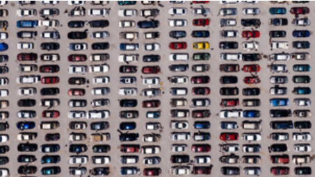 View from above of cars lined up in a parking lot