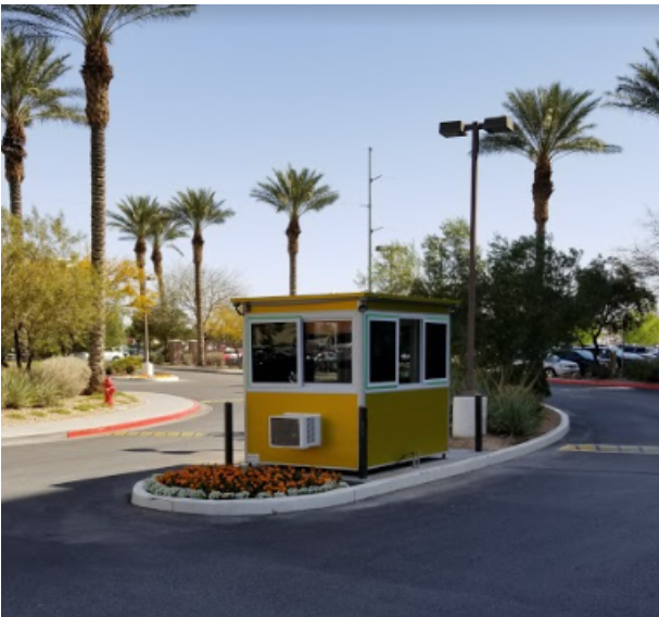 Yellow security booth on a divided road