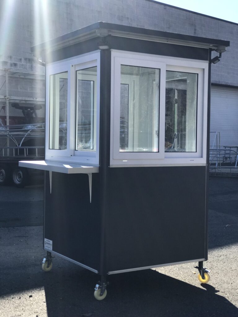4x4 Ticket Booth in Carlsbad, CA with Caster Wheels, Exterior Counter, and Outside Spotlights