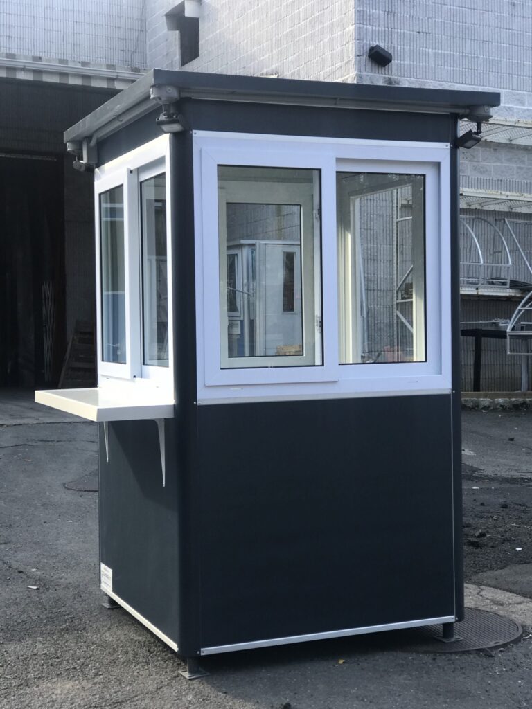 4x4 Ticket and Cashier Booth in Bronx, NY with Custom Exterior Vinyl Wrap, anchoring brackets, exterior desk and floodlights