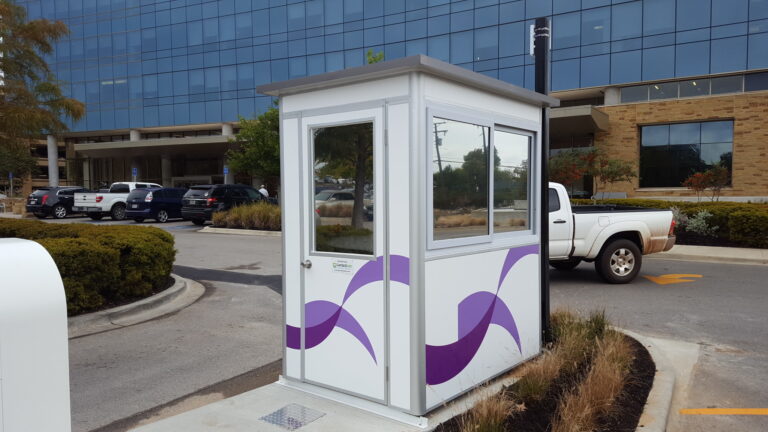 4x6 Parking Booth in Tyler, TX outside a clinic with Swing Door, Custom Graphics, Tinted Windows, and Custom Exterior Color