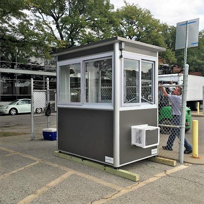 4x6 Security Guard Booth in Chicago, IL on a TV Set with Custom Exterior Color, Built-in AC, Baseboard Heaters, and Anchoring Brackets