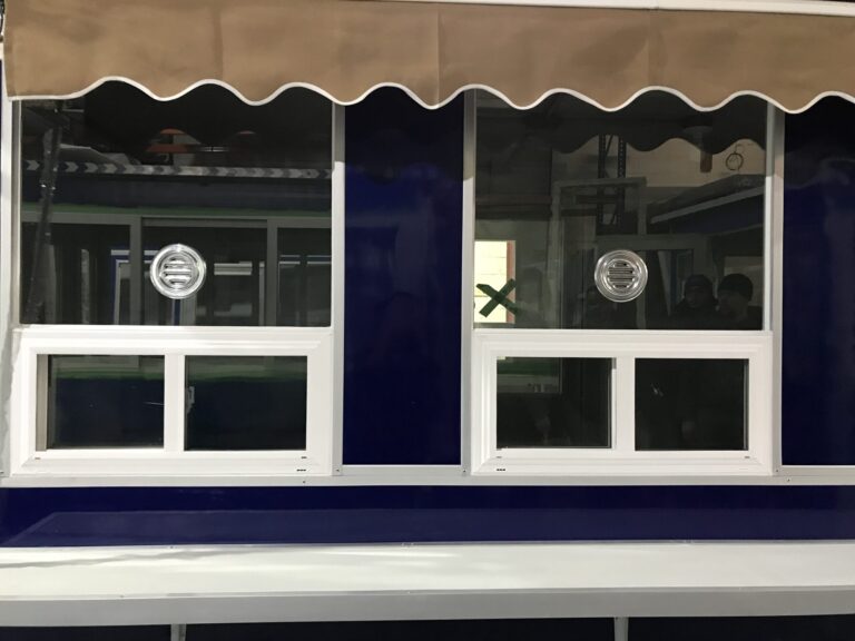 6x16 Booth with Add-On Features Ticket Transaction Windows, Speakers, Sliding Windows, Exterior Counter, and Retractable Awning
