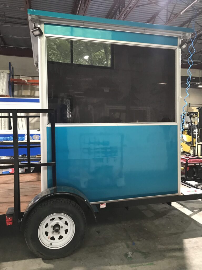 6x6 Trailer Booth in Chalk River, Ontario with Tinted Windows, Outside Spotlights, Custom Exterior Color