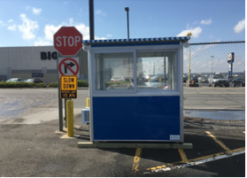 A blue booth on a wood foundation