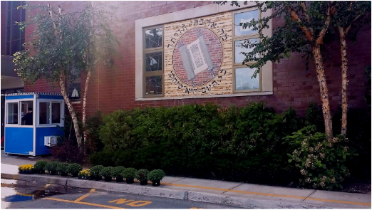 A whitesecurity booth in front of a building