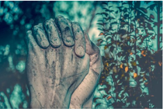 Cement hands folded in prayer