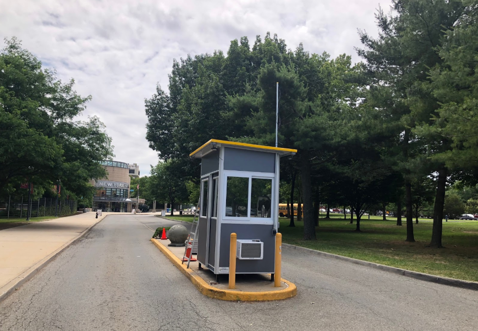 A blue guard booth on a construction site