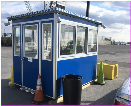 Blue security booth in a parking lot