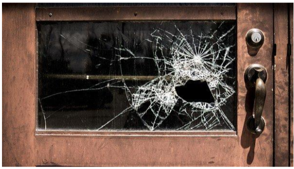 Broken glass on an old door