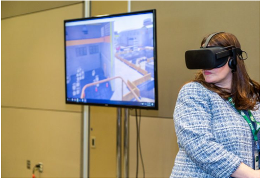 Woman with VR glasses and a VR screen
