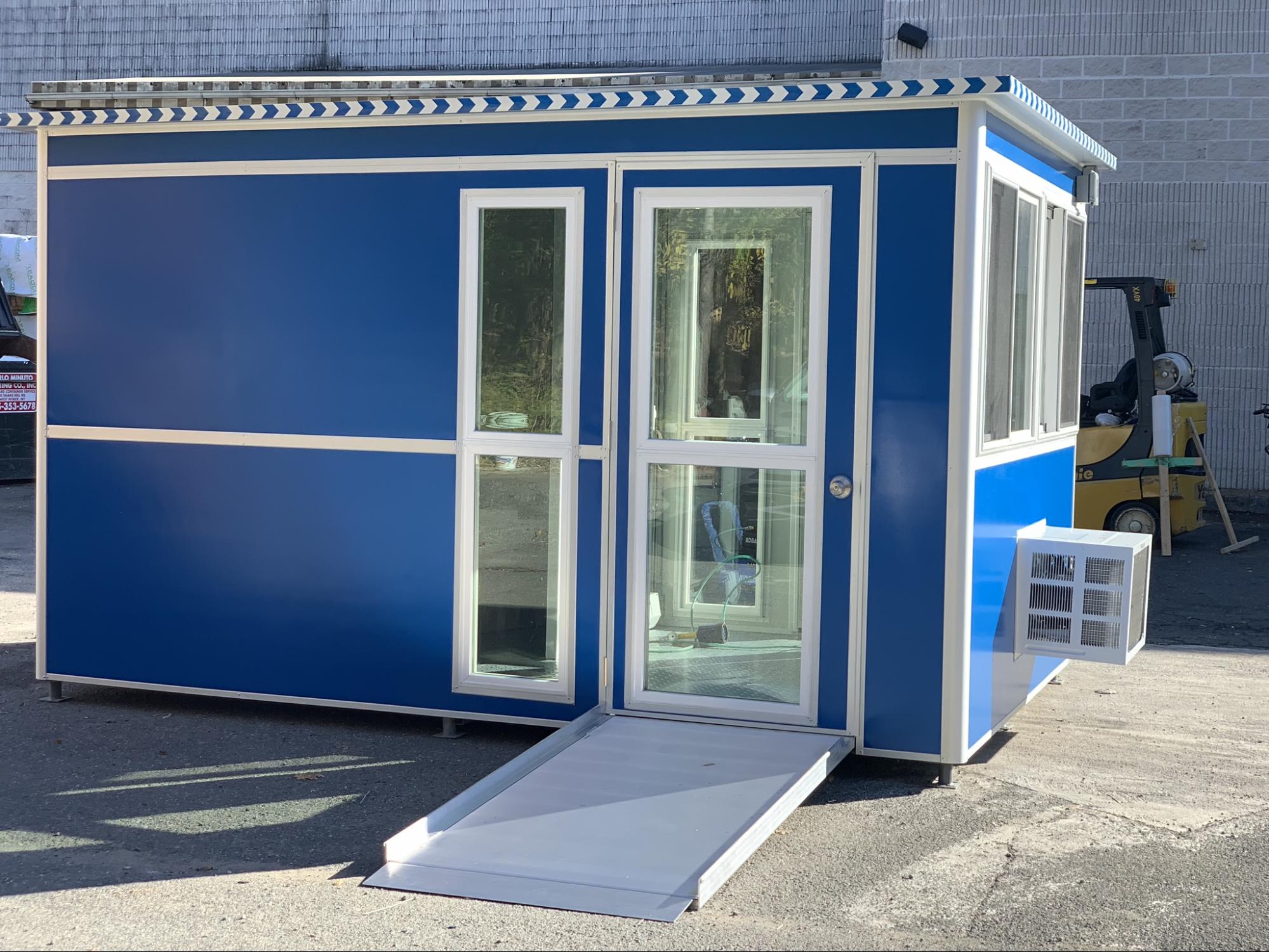 outdoor booth with glass door, a/c unit, and entrance ramp