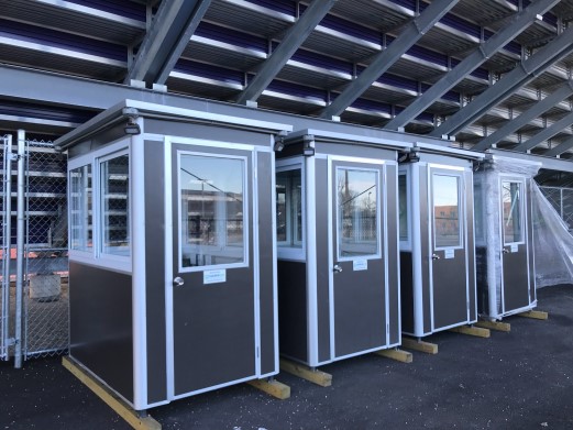 row of brown outdoor booths for safety and warmth in winter