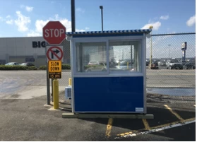 A blue booth on a wood foundation