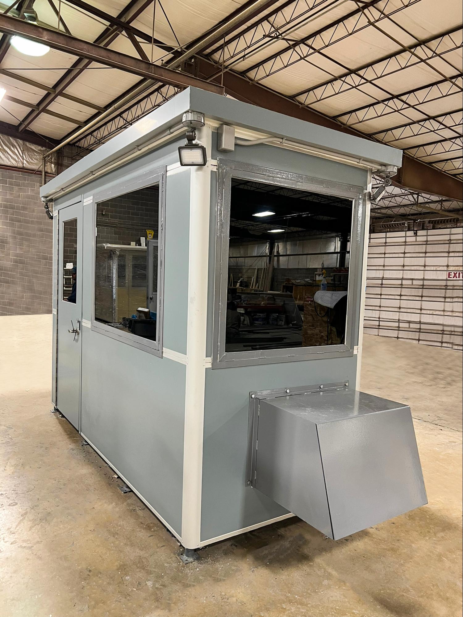 Bullet proof and tinted windows, with custom additions to an entrance gate booth at a military base