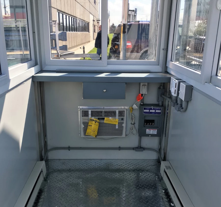 Guardian Booth interior with built-in AC, baseboard heaters and breaker panel box