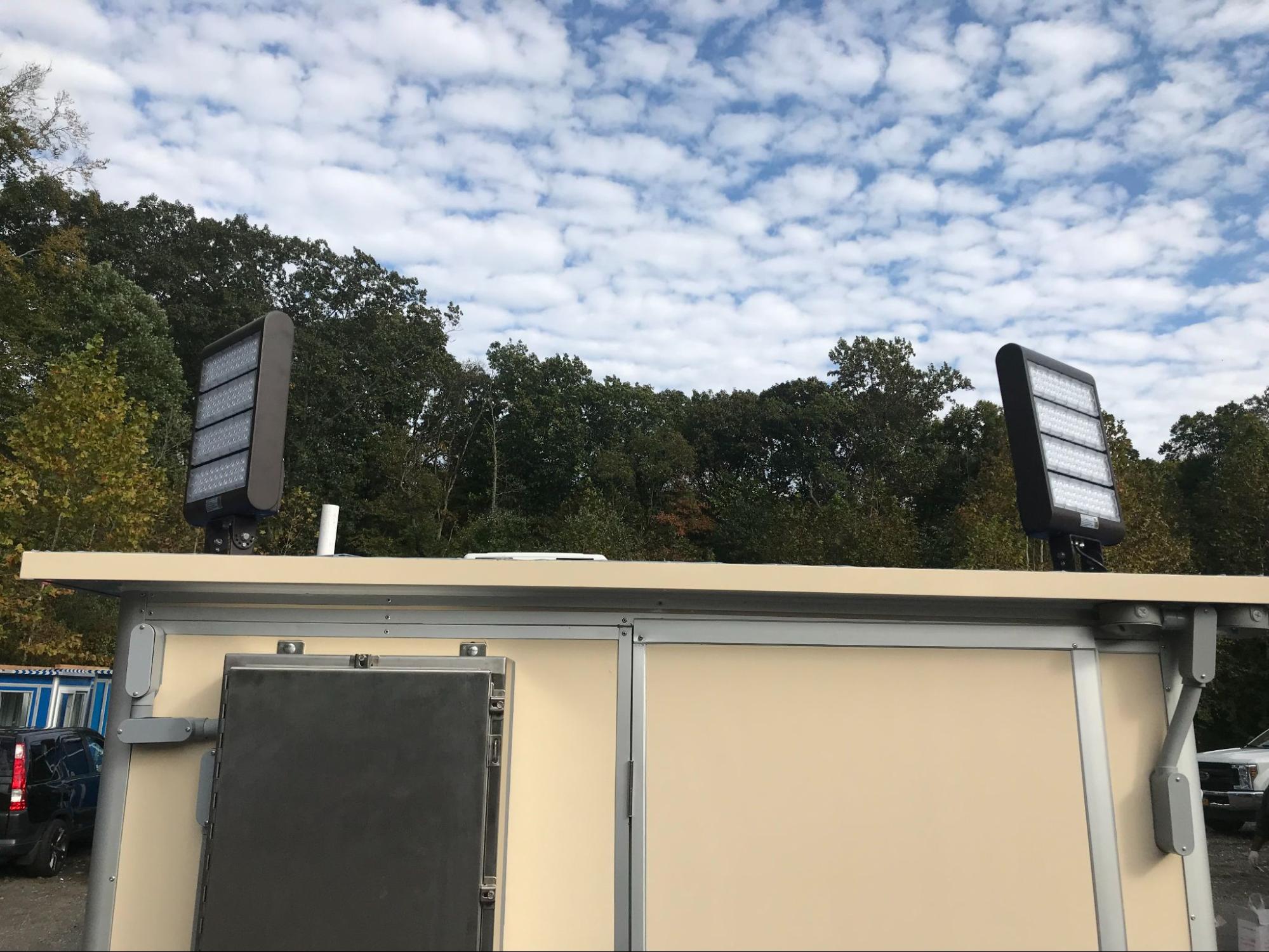 lights on top of prefab construction booth