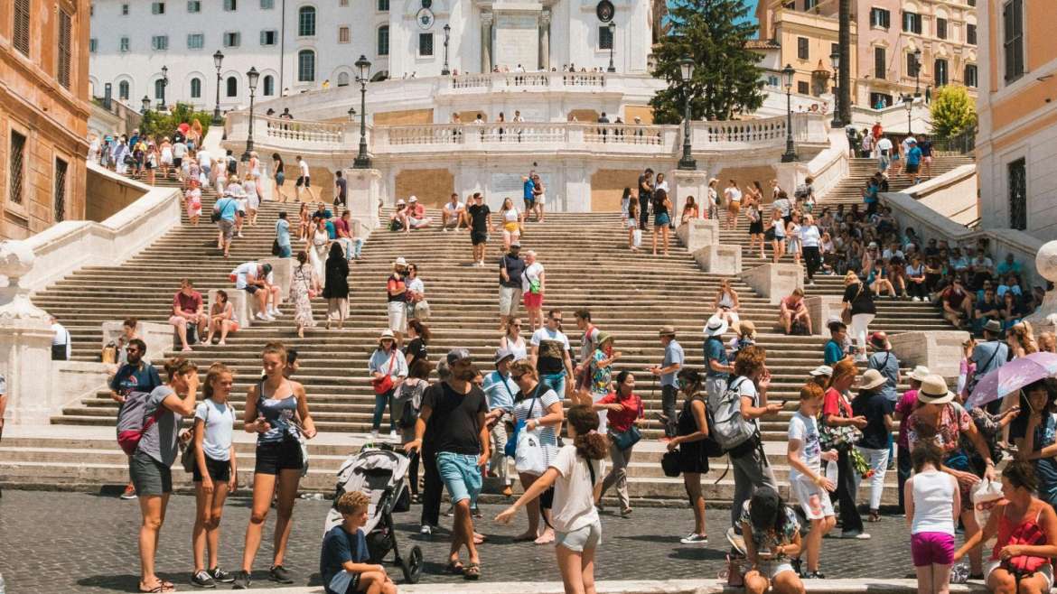 Tourists at destination where tourism information kiosks enhance tourist experience