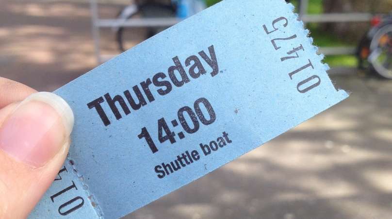 Visitor holding tourism ticket